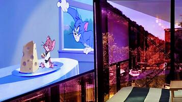 A cartoon character on a table with a window in the background.