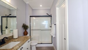 A modern bathroom with a shower, toilet, and sink. - Perfect Masters Week Stay- Spacious Home ONLY 10 Miles from Augusta National (North Augusta)