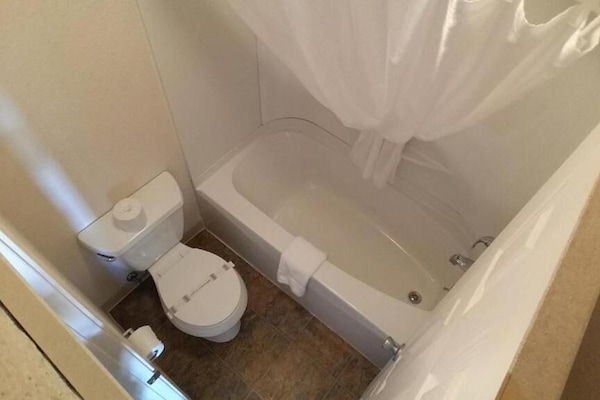 Bathtub, free toiletries, towels, soap