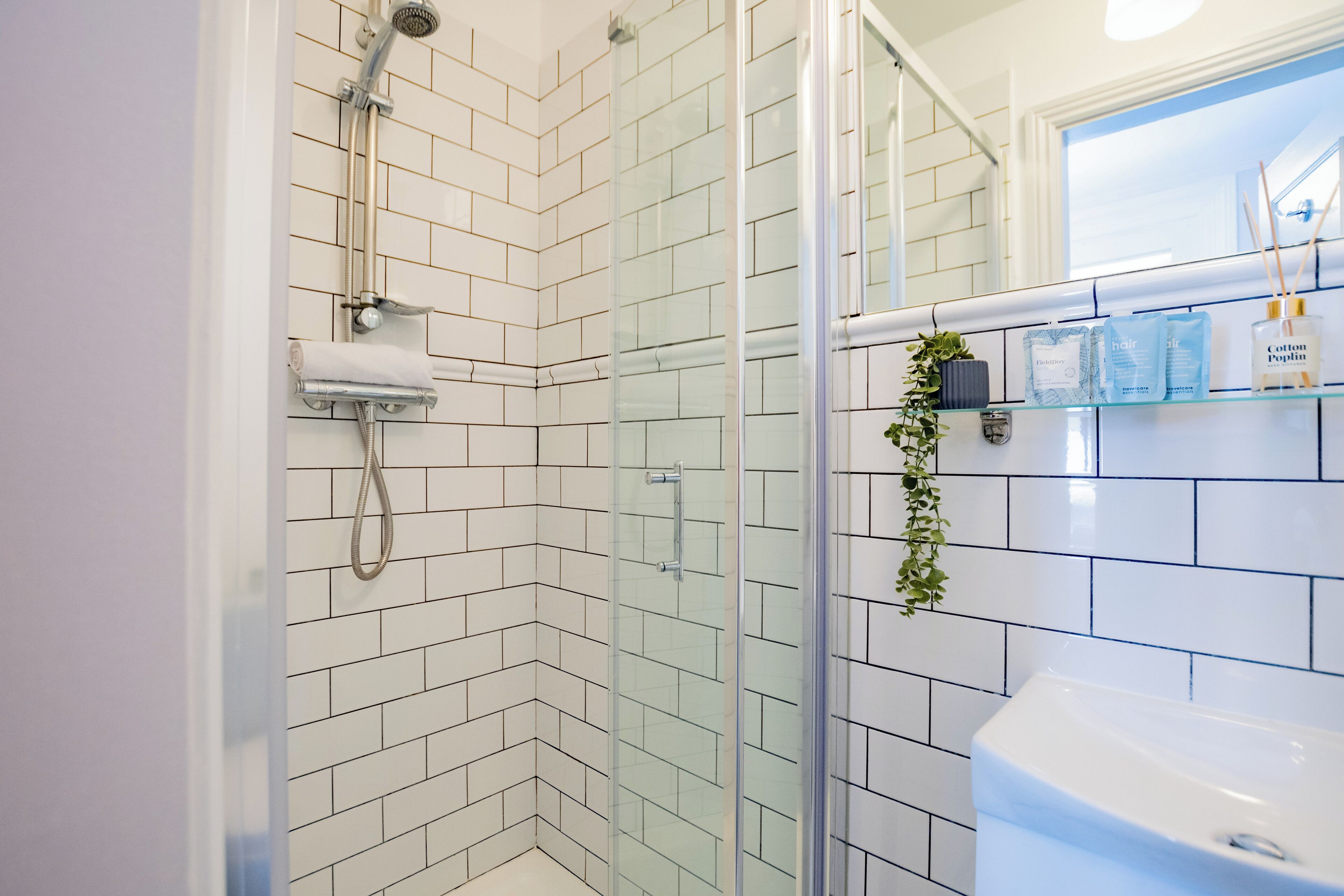 Shower, hair dryer, towels, soap