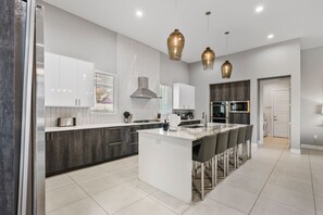 Fridge, microwave, oven, stovetop - Worldwide Luxury | 9BR Luxe Mansion w/ Private Pool, Theater, and Game Room near Disney (Kissimmee)