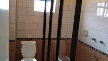 Standard Double Room | Bathroom | Shower, slippers, towels, soap