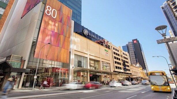 A modern building with a prominent '80' sign and 'RUNDLE PLACE' branding. - KozyGuru | Joslin | Private Self-Contained 1 BR (Joslin)