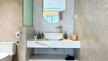 Junior Suite Balcony | Bathroom | Hydromassage showerhead, designer toiletries, hair dryer, bathrobes