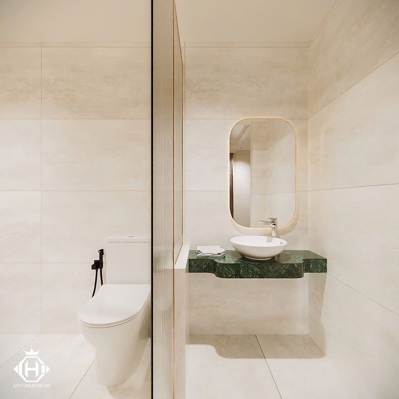 A modern bathroom with a toilet, a sink with a marble countertop, and a large mirror.