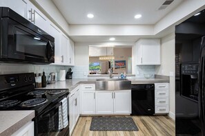 Microwave, oven, stovetop, dishwasher - Palm Desert Escape - Golf, Pools & Mountain Backdrop in this 2 Br Condo (Palm Desert)