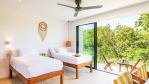 A bedroom with a large window, a ceiling fan, and a bed with a wooden frame. - C307 CPL, Lindo estudio con cama king size-2 (Tulum)