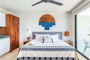 A modern bedroom with a large bed, wooden wardrobe, and a ceiling fan. - D405 CPL, Comodidad y estilo/ AC /Gym-2 (Tulum)