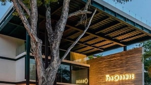 A modern building with a prominent sign reading "PANORAMIC." - 105D PANOR, Large Studio with 360° Pool-2 (Tulum)