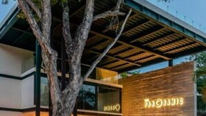 A modern building with a large wooden facade and a sign that reads "PANORAMIC." - PH7B PANOR, Private Paradise in Tulum-2 (Tulum)