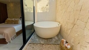 A modern bathroom with a large freestanding bathtub, a glass shower enclosure, and a bed with a view of the outdoors. - Dk Jade 3, Your Exclusive Refuge in Tulum-2 (Tulum)