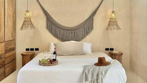 A bedroom with a large bed, two bedside tables, a wooden wardrobe, and a hammock hanging from the ceiling. - COCAY PI 2224, Fresco, Alegre & Vacacional-2 (Tulum)
