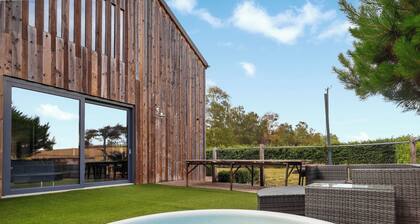 Stylish barn with hot tub, games room and countryside views.