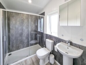 A modern bathroom with a glass-enclosed shower, a toilet, and a sink. - 3 bedroom accommodation in Fitling, near Burton Pidsea (Fitling, near Burton Pidsea)