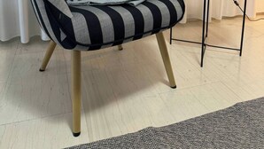 A striped armchair with a grey throw blanket, a small side table with a lamp, and a plant. - Windsor Place - Self Check in After-hours With Code (Vari-Voula-Vouliagmeni)