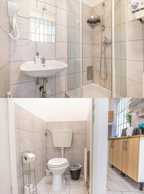 Apartamento básico | Banheiro | Chuveiro, produtos de toalete grátis, secador de cabelo 