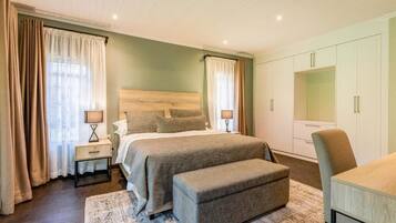 Superior Suite, Patio, Garden View | In-room safe, desk, laptop workspace, blackout drapes