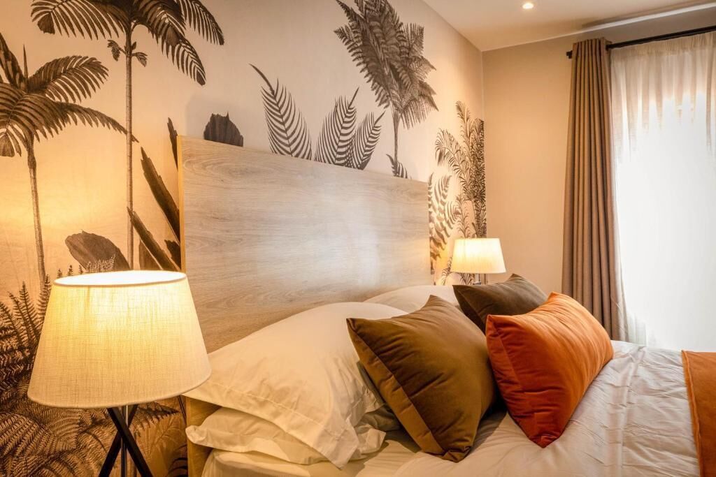 Deluxe Double Room, Garden View | In-room safe, desk, laptop workspace, blackout drapes