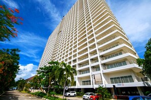 A tall, multi-story hotel with a uniform exterior and balconies on each floor. - Sea View Studio - Jomtien Beachfront - View Talay 8 (Muang Pattaya)