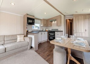 Unclassified image, 2 of 9, button - Silver Caravan with parking (Skegness)