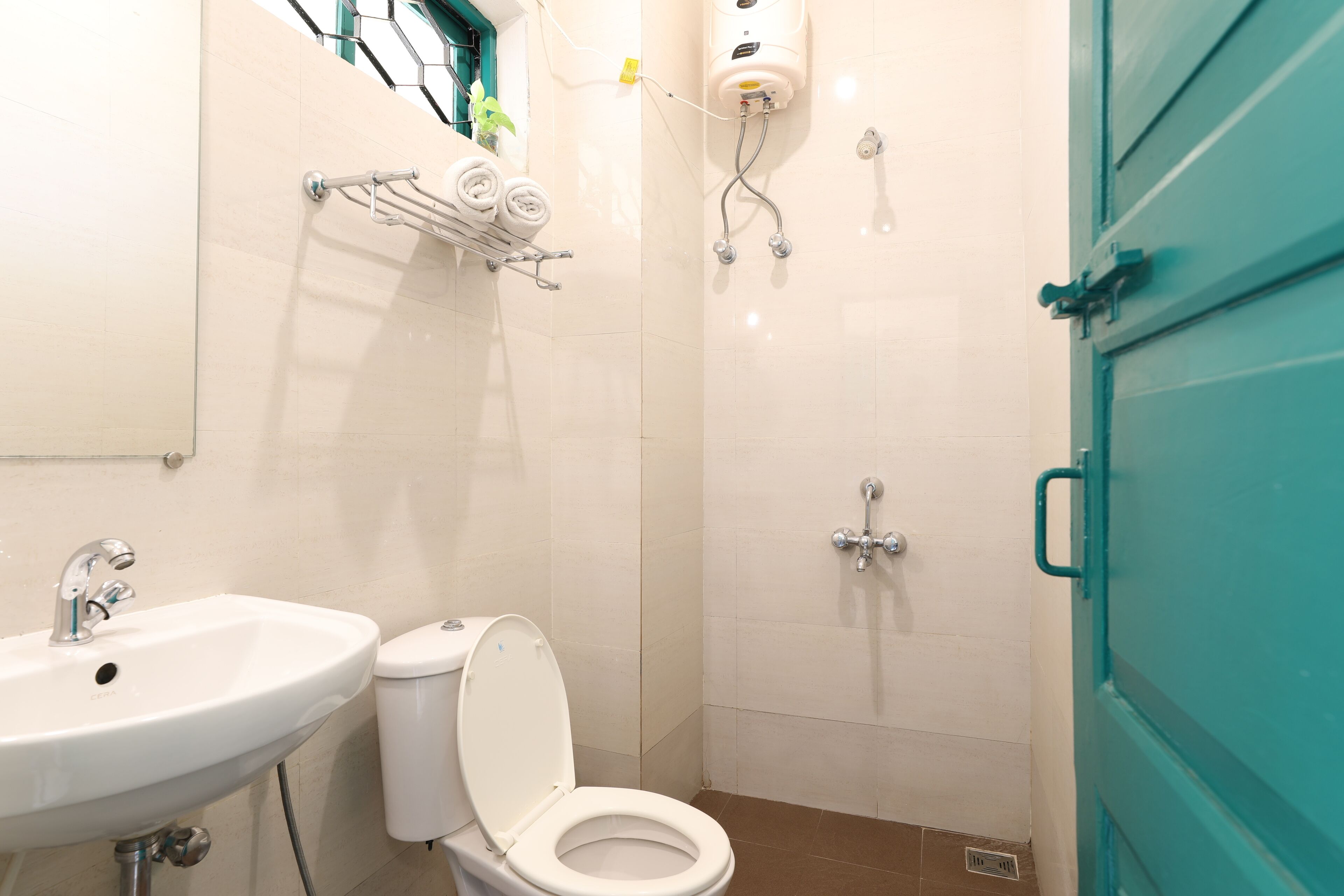 A bathroom with a sink, toilet, and shower.