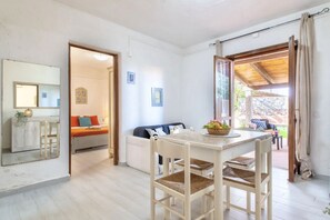 Dining - Two-room apartment of approximately 36 square meters, approximately 100 meters from the sea with simple and not recent furnishingsComprising a living room with a fully equipped kitchenette, a double sofa bed, a double bedroom, and a bathroom with shower. (Marinella)