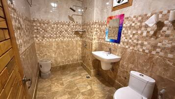 Deluxe Room, Hill View | Bathroom | Soap, shampoo, toilet paper