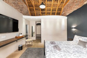 Superior Double Room, Courtyard View | Desk, laptop workspace, blackout drapes, iron/ironing board