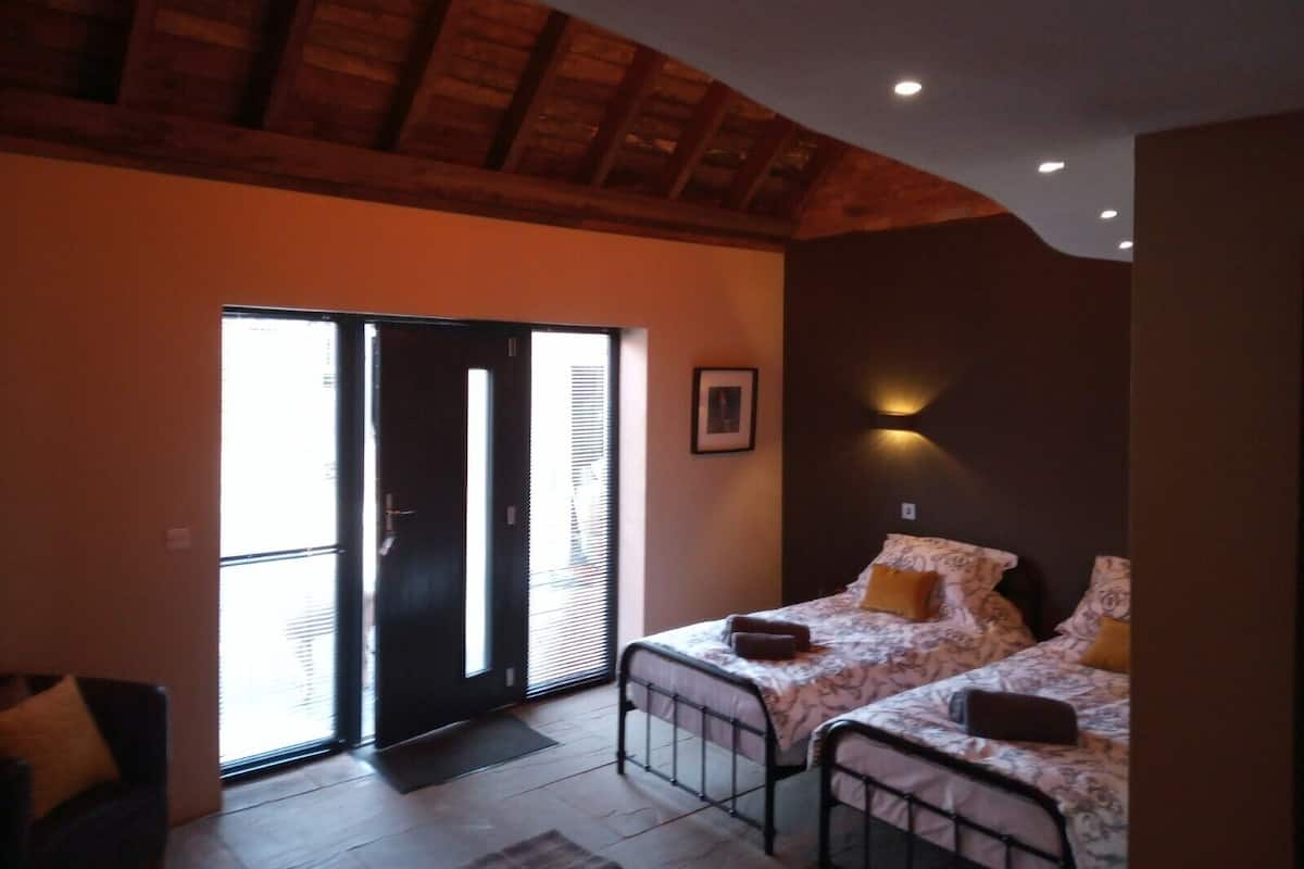 Desk, laptop workspace, blackout curtains, iron/ironing board