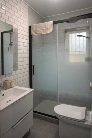 Shower, hair dryer, towels, soap