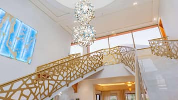 Exclusive Villa, Balcony, Garden View | Living area | 50-inch Smart TV with satellite channels