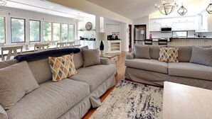 A spacious living area with a sofa set, a coffee table, and a rug. - Sandstorm-New '26, Pet Friendly Home with Outdoor Space (Pawleys Island)