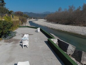 Deluxe Room | Terrace/patio - Flying Sparrow Hotel And Resorts (Ramnagar)