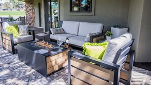 A covered outdoor seating area with a fire pit, a sofa, and chairs. - 2 Mi to Winter Park & Alto Lake! Family Retreat (Alto)