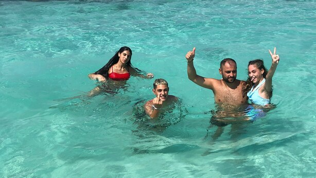 A clear turquoise pool with four people swimming. - 4 Bedrooms 4 Bathrooms Pompeii 900 meters from the center (Pompei)