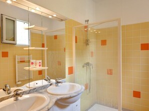 A bathroom with two sinks, a shower, and a mirror. - Spacious Chalet with Terrace for 8 People (Dienné)