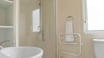 Shower, hair dryer, towels, shampoo