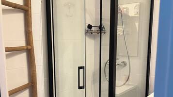 Shower, hair dryer, towels, toilet paper