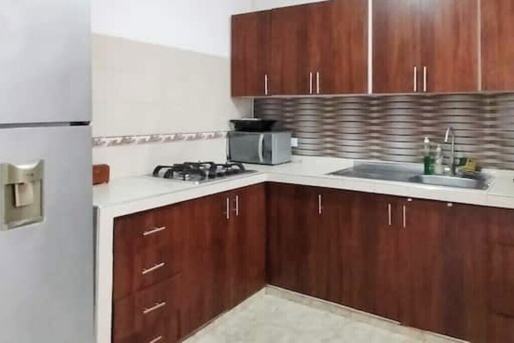 Fridge, coffee/tea maker, toaster, cookware/dishes/utensils