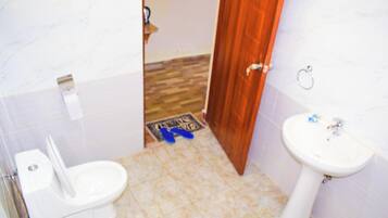 Double or Twin Room, Garden View | Bathroom | Shower, slippers, towels, soap
