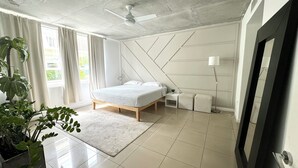 A modern bedroom with a bed, bedside tables, a floor lamp, and a large window with curtains. - Paradise apartment 2 bedroom / 2 Baths with parking in vibrant Miami (Miami)