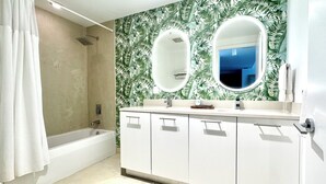 A bathroom with a bathtub, two mirrors, a shower, and a sink with a vanity. - Paradise apartment 2 bedroom / 2 Baths with parking in vibrant Miami (Miami)