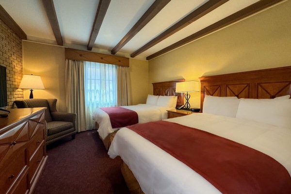 Unwind in crisp linens with spacious beds and warm lighting.