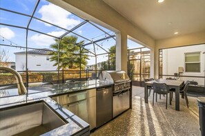 Outdoor dining - EV_2558 - 12 Bed 10 Bath Villa with Screened-In Pool with Spillover Spa, Games (Kissimmee)