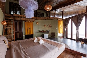 A room with a bed, wooden furniture, a ladder, a small table, and a chair. - Puluong Qui E Ora (Ba Thuoc)