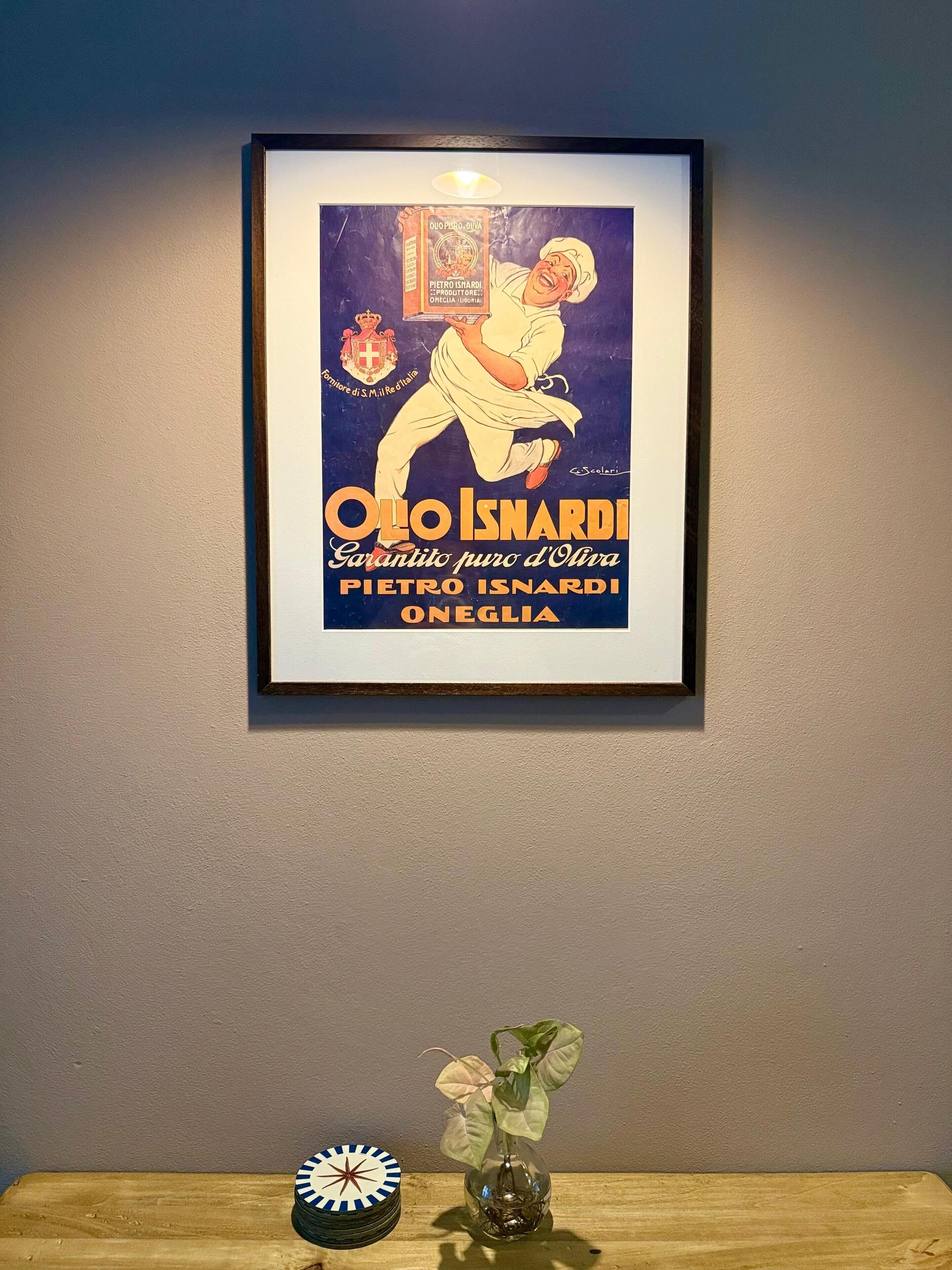 Een ingekaderde vintage poster van Pietro Isnardi aan een muur.