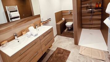 Shower, hair dryer, towels, soap
