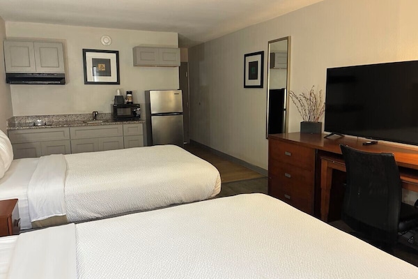 Studio, 2 Double Beds, Non Smoking, Kitchenette | Desk, laptop workspace, blackout drapes, iron/ironing board