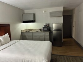 Desk, laptop workspace, blackout drapes, iron/ironing board