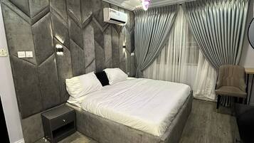 Junior Room, Balcony, City View | Desk, laptop workspace, blackout drapes, soundproofing